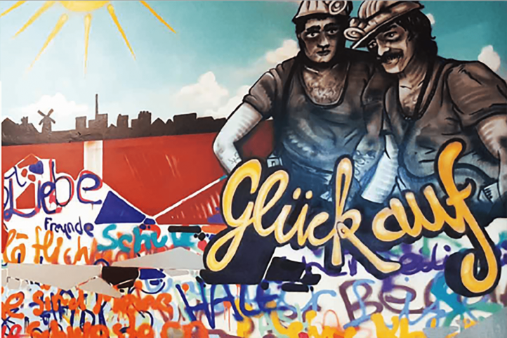 Graffiti mit den Worten "Glück auf" und zwei gemalten Männern
